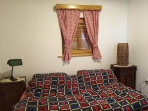 a bedroom with a bed and a window at Jana in Bukovac
