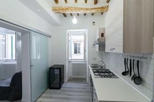 O bucătărie sau chicinetă la Pasticcio Guest House-Locazione Turistica 30013