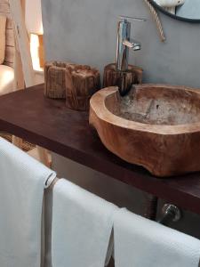 a wooden sink on a table in a bathroom at Cactus Host in Las Palmas de Gran Canaria +97 photos