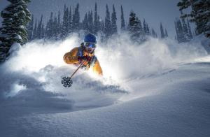 a person is skiing down a snow covered slope at Guest House Karov - 2 Stars in Chepelare