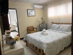 Postel nebo postele na pokoji v ubytování Hotel Casa Telma