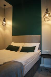 Кровать или кровати в номере Green Park Apartament