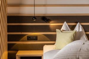 A bed or beds in a room at Garni La Ciasota 3s