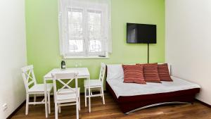 Postel nebo postele na pokoji v ubytování Apartmány Pod Čerťákem