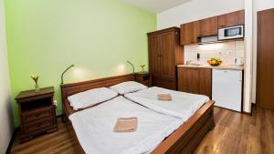 Postel nebo postele na pokoji v ubytování Apartmány Pod Čerťákem