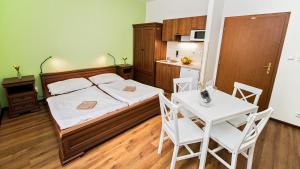 Postel nebo postele na pokoji v ubytování Apartmány Pod Čerťákem