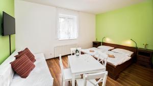 Postel nebo postele na pokoji v ubytování Apartmány Pod Čerťákem