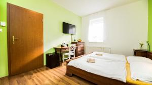 Postel nebo postele na pokoji v ubytování Apartmány Pod Čerťákem