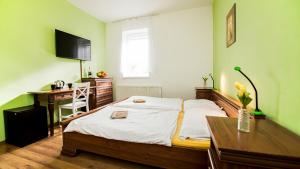 Postel nebo postele na pokoji v ubytování Apartmány Pod Čerťákem