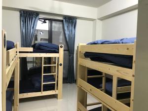 Tempat tidur susun dalam kamar di Sam-Lin Hostel