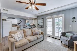 a living room with a couch and a ceiling fan at Cottages at Fair Haven Cove in Cape Fair