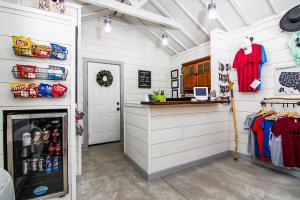 a kitchen with a counter and a refrigerator at Cottages at Fair Haven Cove in Cape Fair