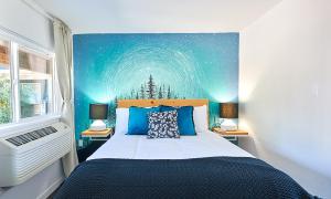 a bedroom with a large bed with a starry sky at Kenton Hotel in Portland