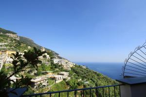 a view of a hill with houses and the ocean at Casa Maria Grazia in Positano