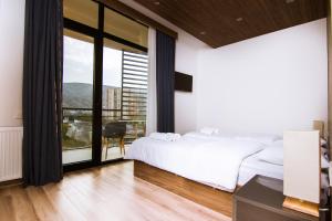Postel nebo postele na pokoji v ubytování Victoria Inn Tbilisi