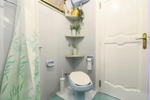 a small bathroom with a toilet and a shower at Casa Maria Grazia in Positano