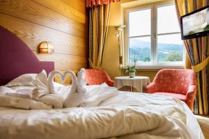 Ένα ή περισσότερα κρεβάτια σε δωμάτιο στο Dominik Alpine City Wellness Hotel - Adults only