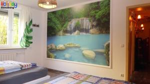 Postel nebo postele na pokoji v ubytování Ferienwohnung Jungle Adventure