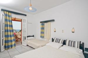 Postel nebo postele na pokoji v ubytování Ydreos Studios & Apartments