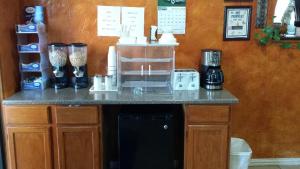 a kitchen with a counter with a coffee maker on it at Carefree Inn Flatonia in Flatonia