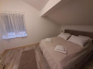 Postel nebo postele na pokoji v ubytování Apartment Queen