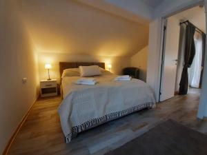 Postel nebo postele na pokoji v ubytování Apartment Queen