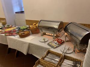 a table with food and baskets of food on it at Zamek Nidzica in Nidzica