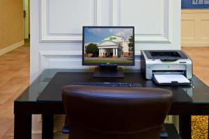 a desk with a computer and a printer on it at Holiday Inn Express Indianapolis Airport, an IHG Hotel in Plainfield