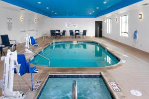 a large swimming pool in a hotel room at Holiday Inn Express Hutchison, an IHG Hotel in Hutchinson