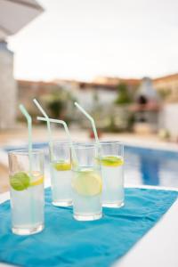 three glasses of water with lemon and lime at Villa Pax in Marčana