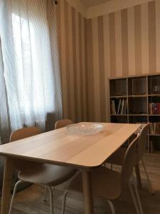 a wooden table in a room with chairs around it at Family house Jurmala in Jūrmala