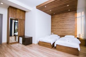 Postel nebo postele na pokoji v ubytování Victoria Inn Tbilisi