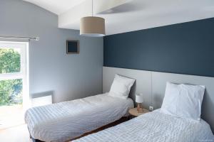 Ένα ή περισσότερα κρεβάτια σε δωμάτιο στο Entre Montagne et lac
