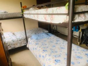 Un ou plusieurs lits dans un hébergement de l'établissement PaCasa Hostel