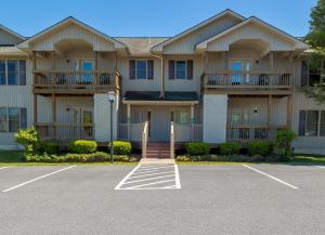 a large apartment building with a parking lot at Massanutten's Woodstone Meadows by TripForth in McGaheysville