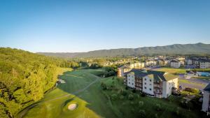 an aerial view of a town with a river and houses at Massanutten's Woodstone Meadows by TripForth in McGaheysville