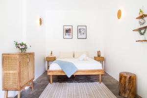 
A bed or beds in a room at Siembra Boutique Hostel - Minca
