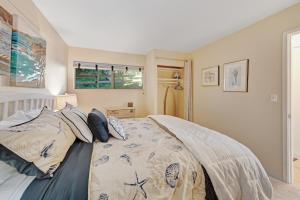 a bedroom with a bed with pillows on it at Embarcadero Bay View in Newport