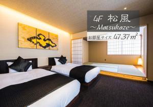 Tempat tidur dalam kamar di Hotel ZIZI Kyoto Gion