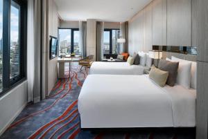 เตียงในห้องที่ โรงแรม นิกโก้ กรุงเทพ - SHA Extra Plus Certified