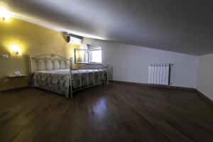 Posteľ alebo postele v izbe v ubytovaní La Mansarda Di BellaVista
