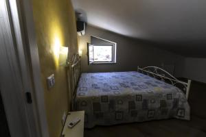 Posteľ alebo postele v izbe v ubytovaní La Mansarda Di BellaVista