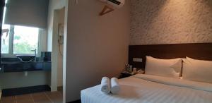 Voodi või voodid majutusasutuse MIICO Hotel @ Mount Austin toas