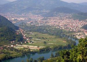 an aerial view of a town next to a river at Apartman Goražde in Goražde