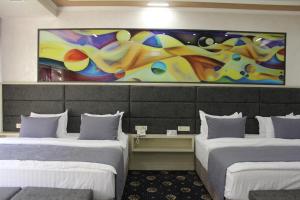 Ένα ή περισσότερα κρεβάτια σε δωμάτιο στο Erebuni Hotel Yerevan