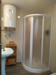 a bathroom with a shower and a sink at CASA EL REMANSO DE ZUHEROS in Zuheros