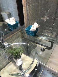 a bathroom with a sink and a mirror and towels at Plan de Cuques T2 in Marseille +77 photos