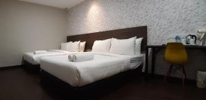 Voodi või voodid majutusasutuse MIICO Hotel @ Mount Austin toas