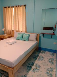 Кровать или кровати в номере Uptown Guesthouse