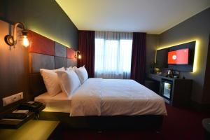 Postel nebo postele na pokoji v ubytování A11 Hotel